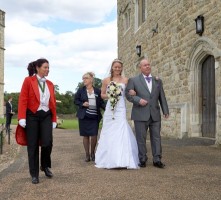 Your_lady_toastmaster_escorting_bride_and_father_to_the_wedding_ceremony_leeds_castle